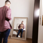 bearded gay stud admires himself in mirror